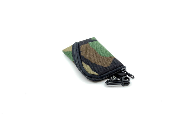 A Super Mini Ghost Whale Pouch in Beaver Camo (green, brown, tan, and black camoflauge pattern).